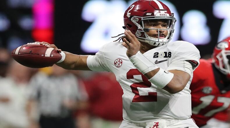 Alabama quarterback Jalen Hurts passes against Georgia during the College Football Playoff National Championship at Mercedes-Benz Stadium in Atlanta on January 8, 2018. (Curtis Compton/Atlanta Journal-Constitution/TNS)