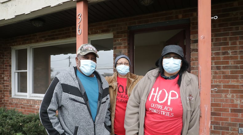 Alonzo McCoy, Edith Davis, center, and Michelle Speaks from the HOP Outreach Ministries, in front of the building that was donated to their food pantry for the winter. The building was donated by Dr. John Bruce of the Northwood Animal Hospital. BILL LACKEY/STAFF