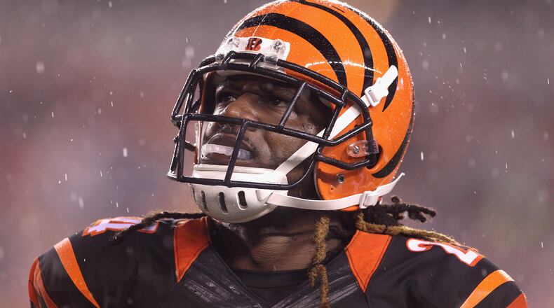 Adam Jones of the Bengals looks models the Bengals’ stylish helmet before the AFC Wildcard Playoff game against the the Steelers at Paul Brown Stadium on January 9, 2016 in Paul Brown Stadium.