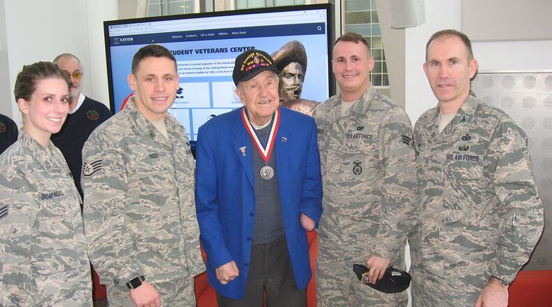 Col. Leonard Rose, 88th Mission Support Group commander, along with Staff Sgt. Michael Reed, Senior Airman Scott Dymacek and Senior Airman Joice Dominguez meet with World War II veteran Thomas Anderson at the Xavier University Student Veterans Center Feb 3. (U.S. Air Force photo/Mark C. Lyle)
