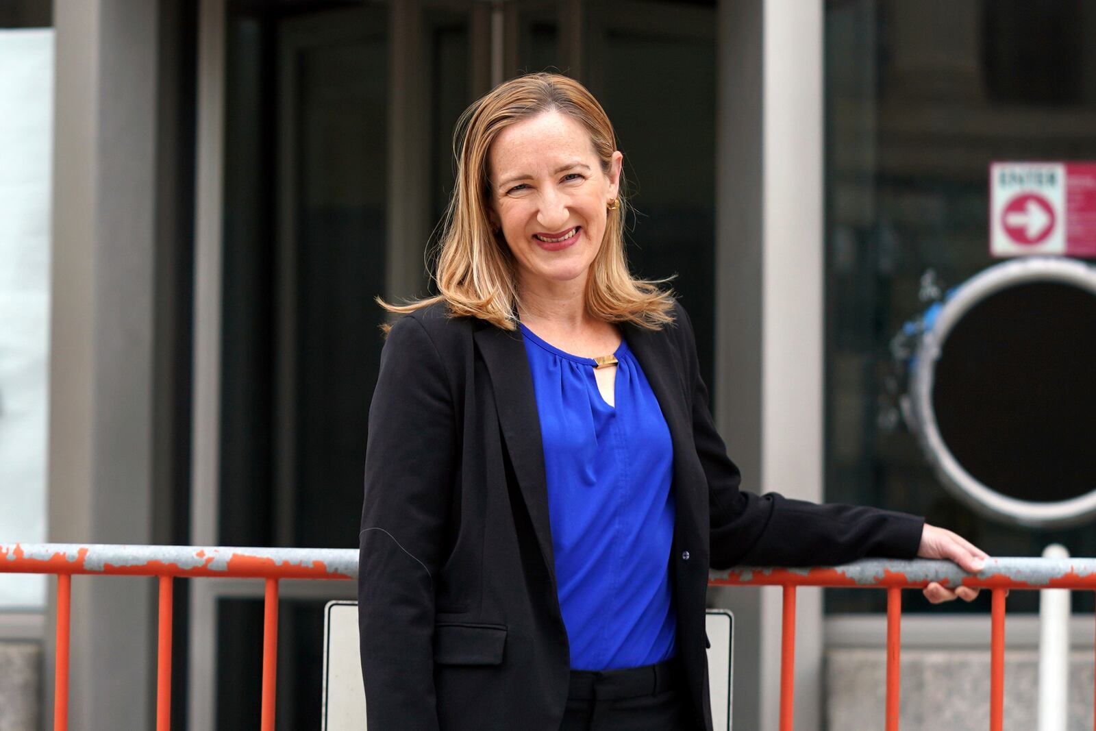 Laura Meissner poses for a portrait in front of the United States Agency for International Development (USAID) headquarters, Wednesday, April 2, 2025, in Washington. (AP Photo/Rahmat Gul)
