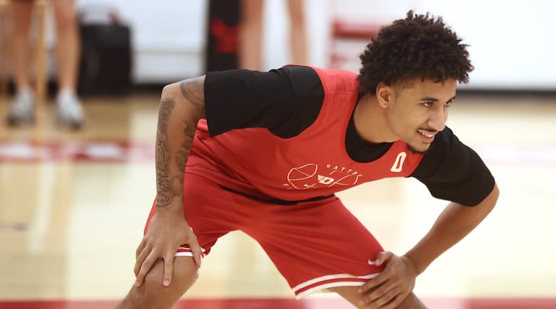 Dayton's Javon Bennett stretches during practice at the Cronin Center on Wednesday, Oct. 8, 2025. David Jablonski/Staff