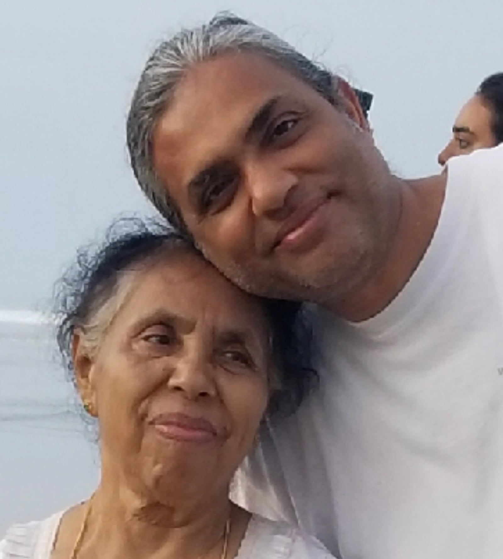 Father Satish Joseph hugging his mom Licykutty who is now 88 and lives back in India with Satish’s older brother, Suresh, in a house that includes four generations of the family. Father Satish visits India twice a year. CONTRIBUTED