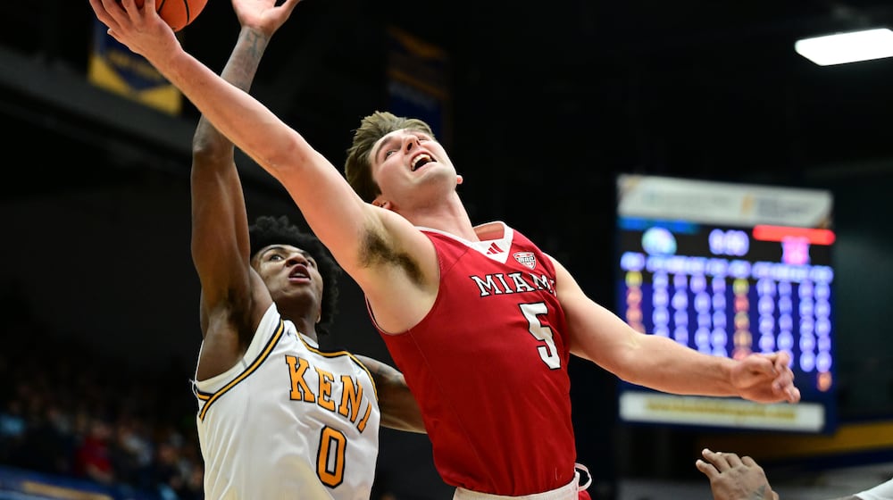 Miami (OH) RedHawks guard Peter Suder goes to the basket against Kent State forward Rayvon Griffith during the first half of an NCAA college basketball game, Tuesday, Jan. 20, 2026, in Kent, Ohio. (AP Photo/David Dermer)