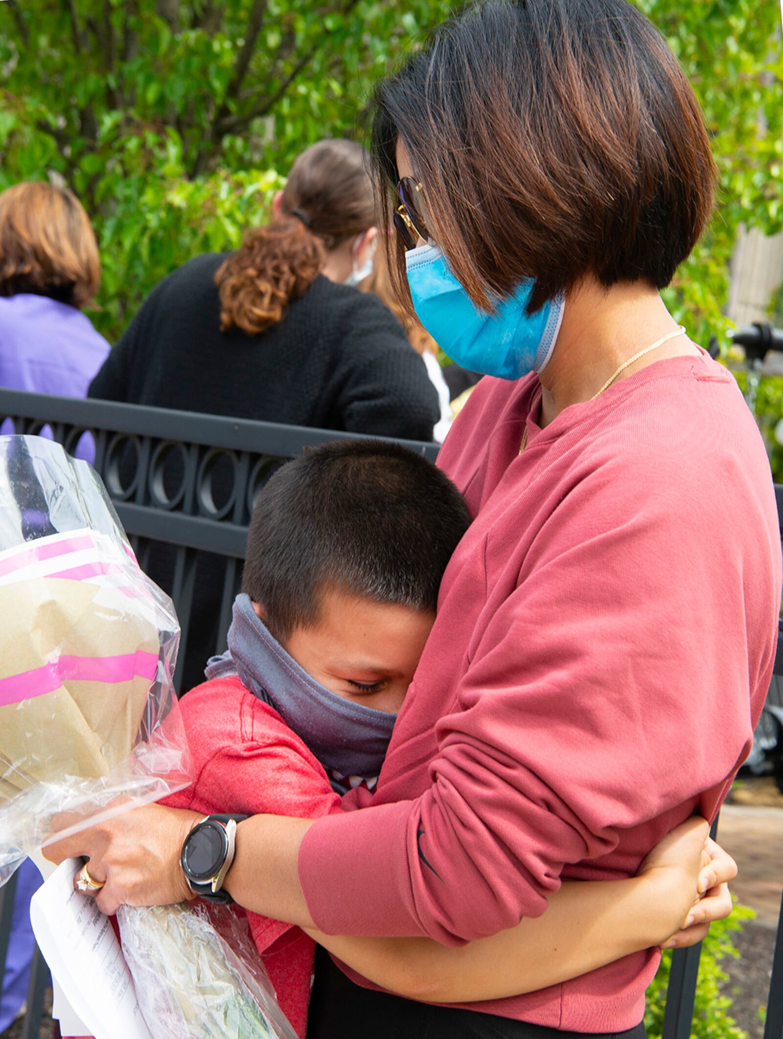 Sebastian Ogilvie, 8, hugs his mother, Senior Airman Evelyn Ogilvie, shortly after she stepped off the bus May 18 at Wright-Patterson Medical Center, returning from a two-month deployment to Detroit. She was one of nearly 120 Airmen from the 88th Medical Group who deployed to support a mass COVID-19 vaccination site. U.S. AIR FORCE PHOTO/R.J. ORIEZ