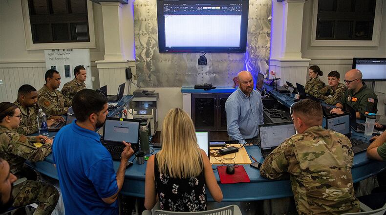 Air Force innovators meet for a brainstorming session in robotic process automation at Joint Base Charleston, S.C., in June 2021. The Air Force Research Laboratory is spearheading a pilot project, titled Innovative Pathway Initiative, designed to revamp and expedite the ideas of pioneering Airmen, Guardians and civilians from start to finish. U.S. AIR FORCE PHOTO/STAFF SGT. CHRISTIAN SULLIVAN