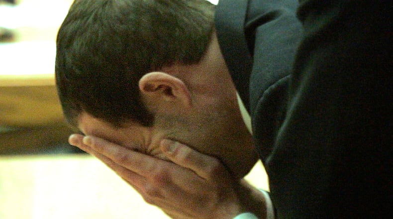Ryan Widmer collapses into tears Feb. 14, 2011, after the jury’s guilty verdict is read in Warren County Common Pleas Court in Lebanon, Ohio. FILE