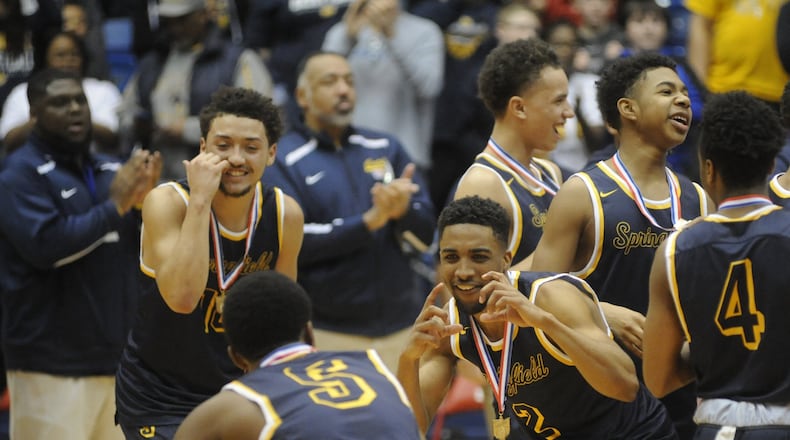 Springfield’s Michael Wallace mugs for Lazarus Toliver. Springfield defeated Oak Hills 46-42 in OT in a boys high school basketball D-I district final at UD Arena on Saturday, March 11, 2017. MARC PENDLETON / STAFF