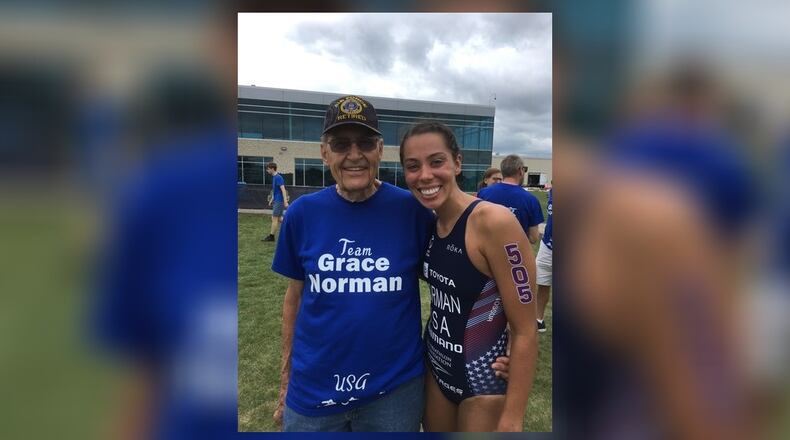 Grace Norman – pictured here with her grandfather – was surprised by her family at the Americas Triathlon Para Championships in Pleasant Prairie, Wisconsin on June 27. The group all wore Grace Norman t-shirts. She won in Wisconsin and that put her on the US Paralympic team for the 2021 Tokyo Games which begin in August. She is the defending gold medal winner, having won the paratriathlon PT4 class (now renamed the PTS5 category) in Rio de Janeiro Brazil in 2016. CONTRIBUTED