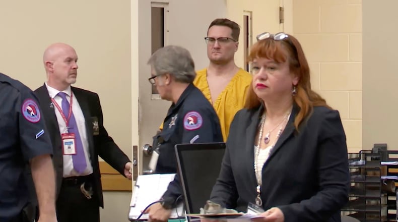 This image taken from video shows Michael David McKee walking into the courtroom on Monday, Jan. 12, 2026, in Rockford, Ill. (WIFR News/Pool Photo via AP)