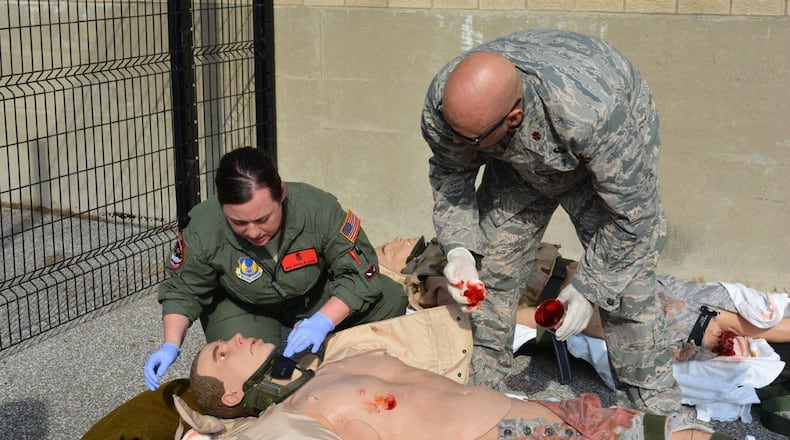 A member of the C-STARS cadre prepares a ‘patient’ for a training simulation exercise during Tactical Critical Care Evacuation Team Training at the Cincinnati Center for Sustainment of Trauma and Readiness Skills. (Contributed photos)