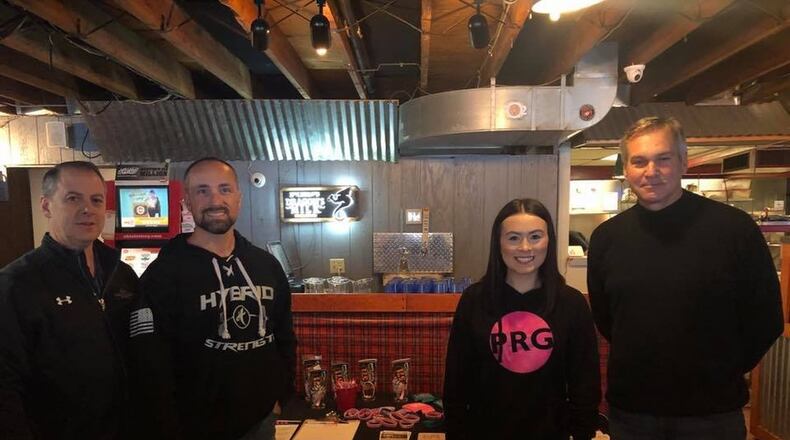 The New Carlisle Rotary Club and The Pink Ribbon Girls hosted a kick-off event to promote their new fundraiser, the Push-up Challenge. MATT CLEVENGER/COURTESY