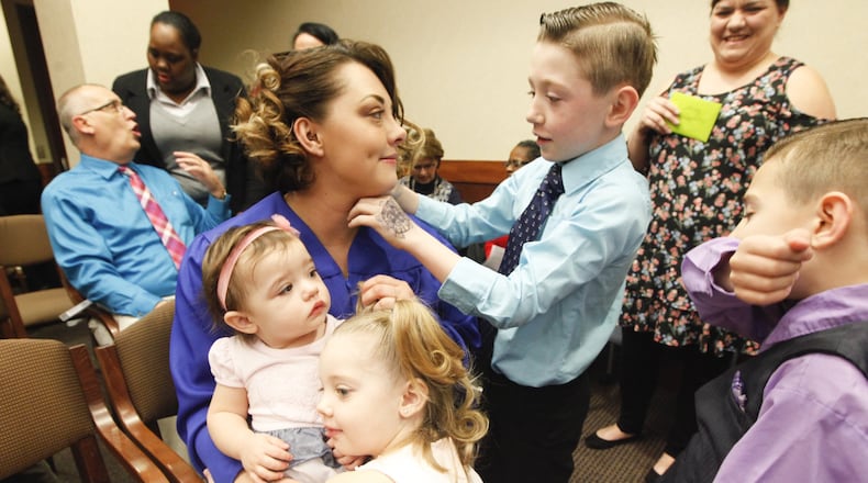 Bethany Hampton graduated from Family Treatment Court on Wednesday at Montgomery County Juvenile Court. To help celebrate were her sons Avory, 9, and Addison, 7, and daughters Alayna, 4, and Arily, 1. CHRIS STEWART / STAFF