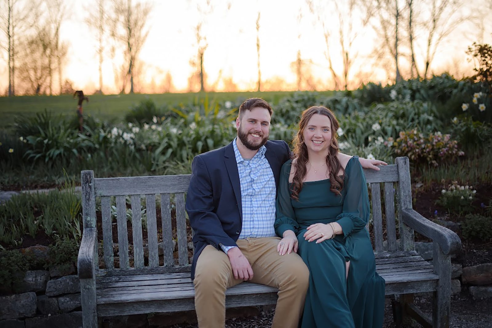 Lauren Hall (Right) with her fiance Alex Smith sitting at Cox Arboretum for their official engagement pictures. CONTRIBUTED