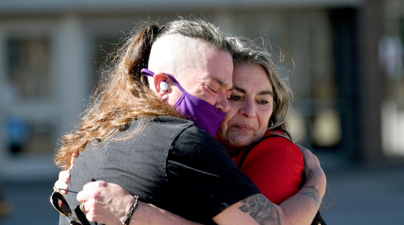 Crystina Page, left, hugs Angelika Stedman outside of the El Paso County Courthouse in Colorado Springs, Colo., Friday, Feb. 6, 2026, ahead of the sentencing of Return to Nature funeral home owner Jon Hallford. (AP Photo/Thomas Peipert)