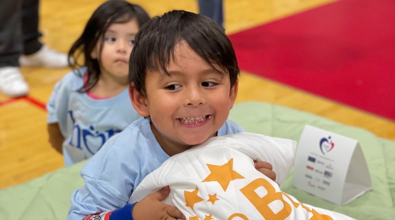 The Morrison Furniture Company, in partnership with Secret Smiles and United Way of Greater Dayton, gifted new beds to 75 children during its Hope to Dream event Saturday. CONTRIBUTED