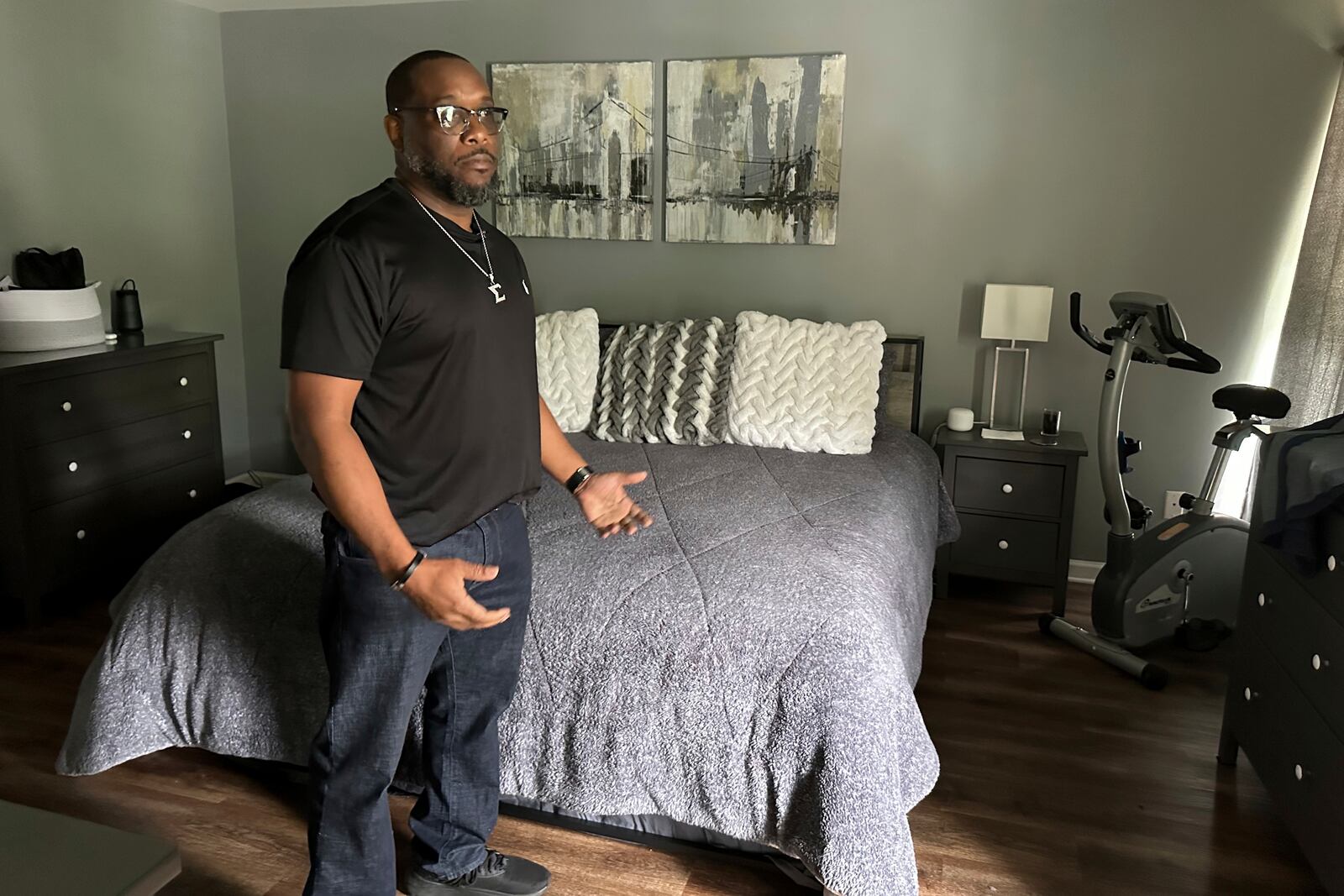 File - Toi Cliatt talks about the raid in the bedroom where he and then-girlfriend Trina Martin were sleeping when the FBI broke into their home, in Atlanta, April 25, 2025. (AP Photo/Sudhin Thanawala, File)