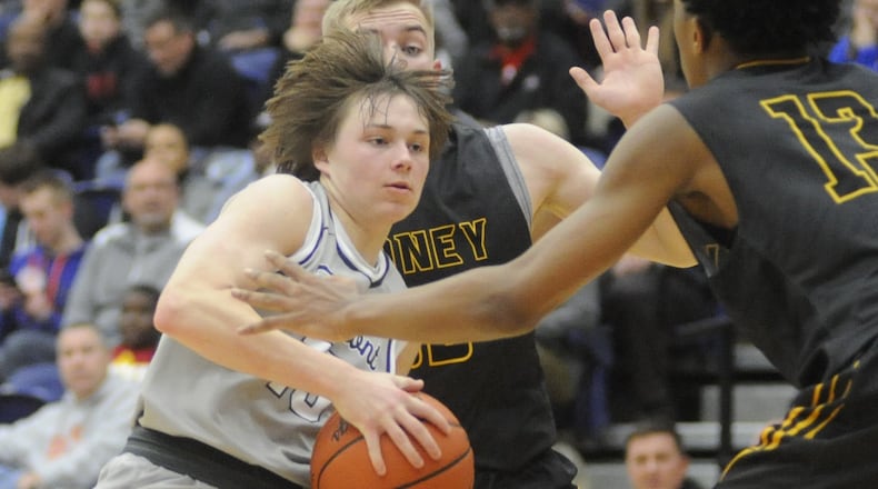 Fairmont’s Jack Hendricks (with ball) is met by Sidney defenders Chris Lee (middle) and Ratez Roberts. Fairmont defeated Sidney 60-51 in the 15th annual Premier Health Flyin’ to the Hoop opener at Kettering’s Trent Arena on Friday, Jan. 13, 2017. MARC PENDLETON / STAFF