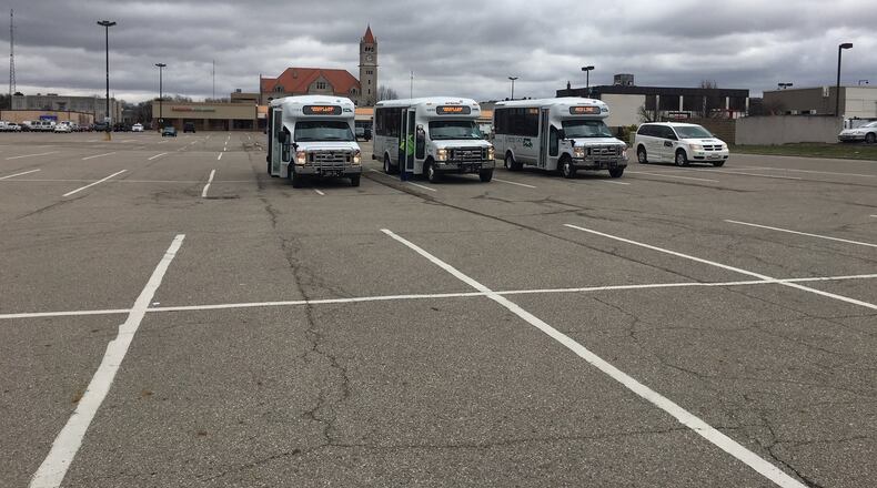 Greene CATS buses now park in the middle of the city-owned parking lot after their no-rent lease with Blue Rock Investments, LLC was terminated. RICHARD WILSON/STAFF