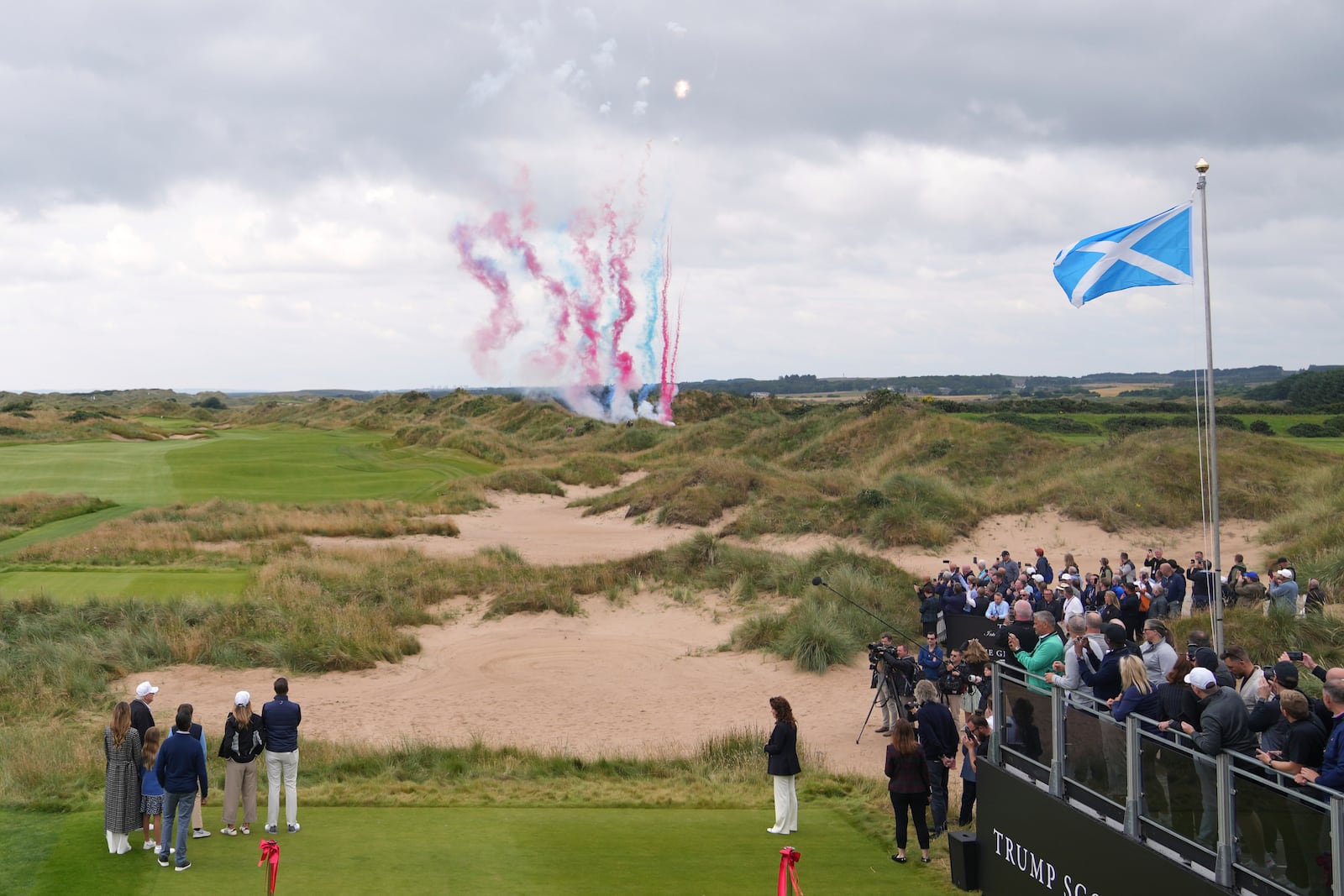 President Donald Trump, left, watches fireworks as he attends the opening ceremony for Trump International Golf Links near Aberdeen, Scotland Tuesday, July 29, 2025.(AP Photo/Alastair Grant)
