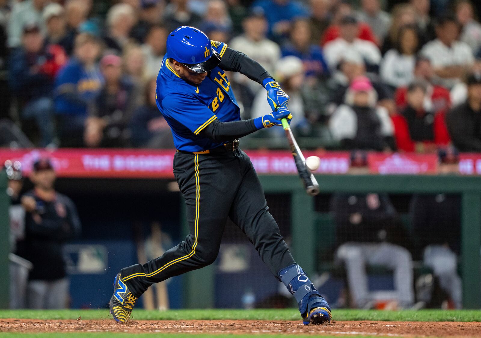 Seattle Mariners' Jorge Polanco hits a solo home run during the eighth inning of a baseball game against the Cleveland Guardians, Friday, June 13, 2025, in Seattle. (AP Photo/Stephen Brashear)