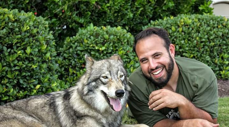 Adam Pinon and one of his wolfdogs, Gretl. Pinon is working through is non profit organization to educate people about animal ownership