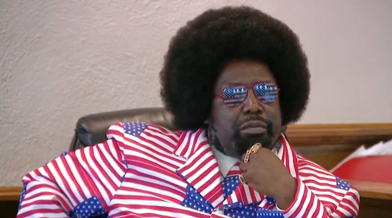 CORRECTS LOCATION: In this image taken from video, rap artist Afroman testifies in court on Tuesday, March 17, 2026, in West Union, Ohio. (WCPO via AP)