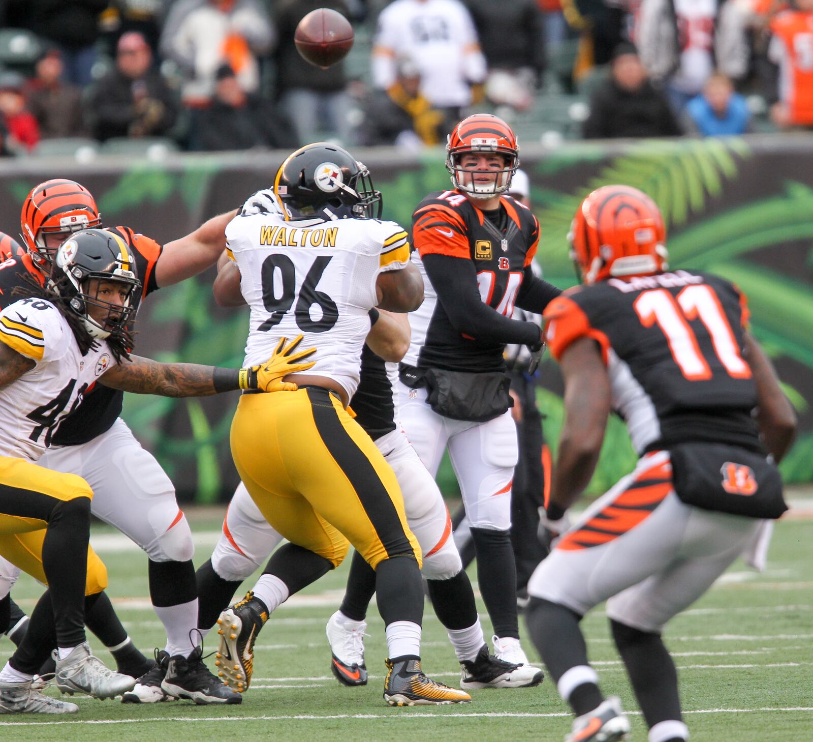 Bengals quarterback Andy Dalton (14) looks to complete a pass to wide receiver Brandon LaFell (11) during their game against the Steelers at Paul Brown Stadium, Sunday, Dec. 18, 2016. GREG LYNCH / STAFF