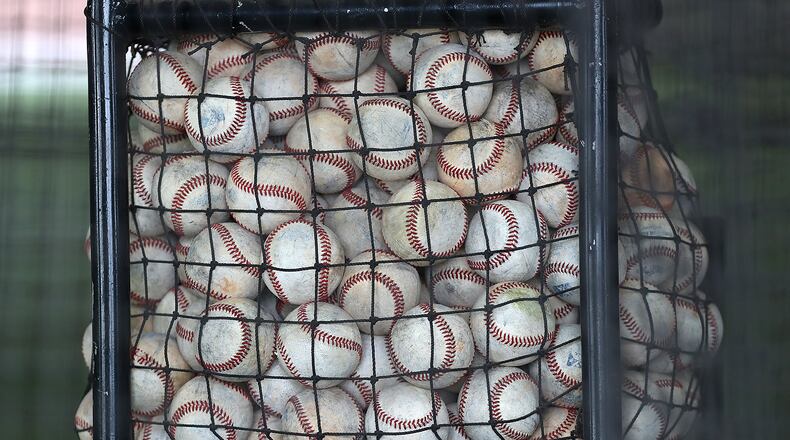 A bucket of baseballs. Curtis Compton/ccompton@ajc.com