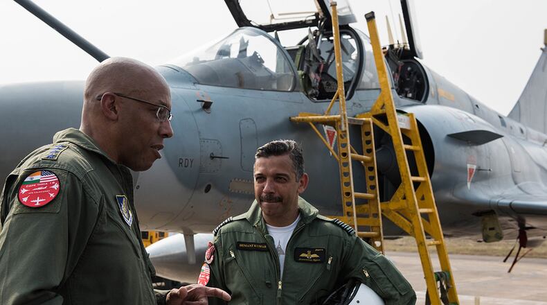 Gen. CQ Brown Jr., Pacific Air Forces commander, discusses his orientation flight in an Indian Air Force Mirage 2000 at Cope India 19 at Kalaikunda Air Force Station, India, Dec. 14. Total participation in the exercise included more than 200 U.S. Airmen, F-15 Eagles from the 18th Wing, Kadena Air Base, Japan, and C-130J Super Hercules from 182nd Airlift Wing, Illinois Air National Guard, alongside IAF airmen operating Sukhoi 30s, Jaguars, Mirage 2000s, C-130Js, as well as Airborne Early Warning and Control System and refueling aircraft. (U.S. Air Force photo/Staff Sgt. Hailey Haux)