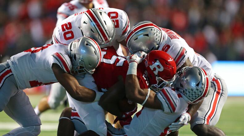 PISCATAWAY, NJ - SEPTEMBER 30: Running back Raheem Blackshear #25 of the Rutgers Scarlet Knights is gang tackled during a game against the Ohio State Buckeyes on September 30, 2017 at High Point Solutions Stadium in Piscataway, New Jersey. (Photo by Hunter Martin/Getty Images)