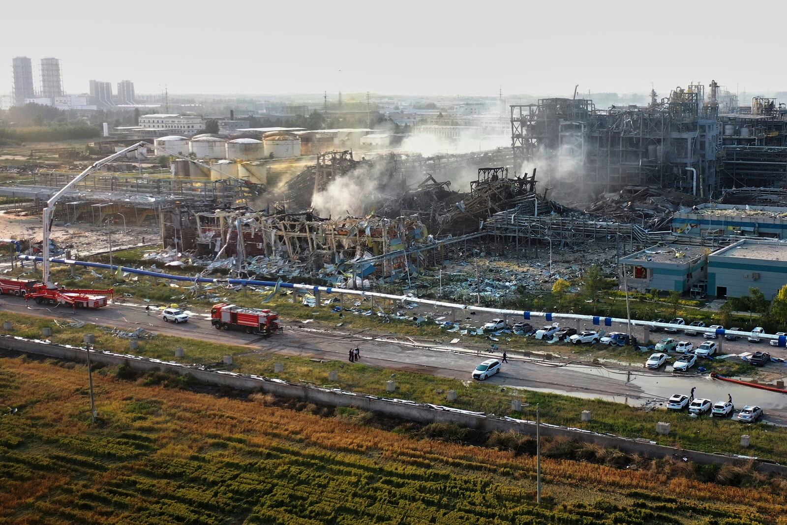 In this photo released by Xinhua News Agency, Firefighters extinguish fires at the explosion site of a chemical plant in Gaomi, in east China's Shandong Province, Tuesday, May 27, 2025. (Xinhua via AP)