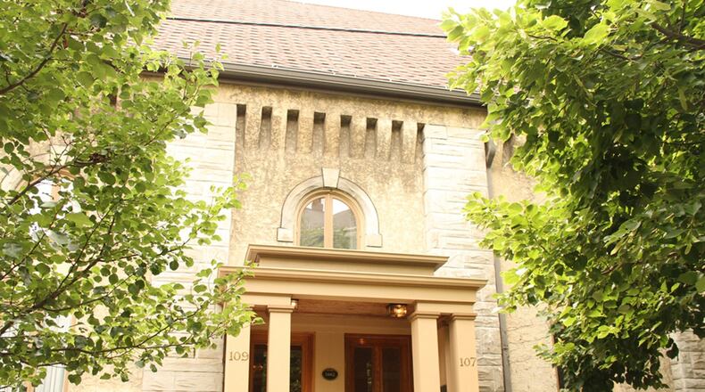 Located in Dayton’s historical Oregon District, this elegant home is one of 4 condominiums designed within a 19th century church. A 5-foot wall provides privacy on the courtyard patio, which is enclosed with an iron gate. CONTRIBUTED PHOTOS BY KATHY TYLER