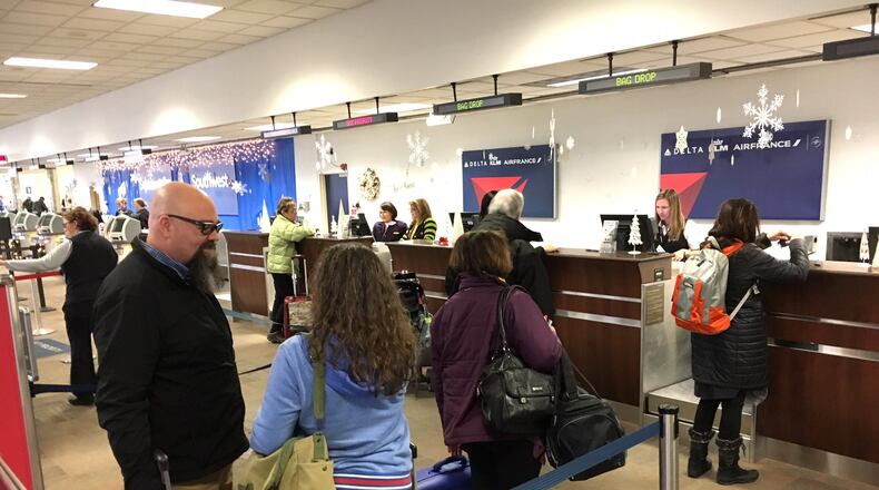Travelers at the Dayton International Airport, Wednesday, Dec. 21, 2016.