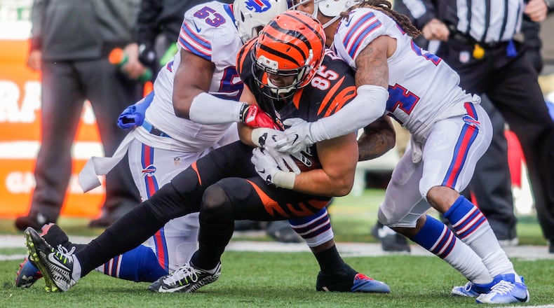 Cincinnati Bengals tight end Tyler Eifert is tackled by Buffalo Bills linebacker Zach Brown (53) and cornerback Stephon Gilmore (24) during their 16-12 loss to the Buffalo Bills Sunday, Nov. 20 at Paul Brown Stadium in Cincinnati. Woods was injured on the play. NICK GRAHAM/STAFF