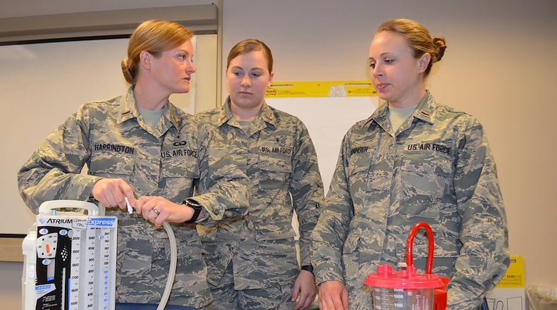 From left: Second Lt., Hunni Harrington, 2nd Lt. Jenna Schuckman and 2nd Lt. Rachel Reininger take apart a chest tube during a classroom course Feb. 16 as part of the Nurse Transition Program at UC Medical Center. (Courtesy photo)