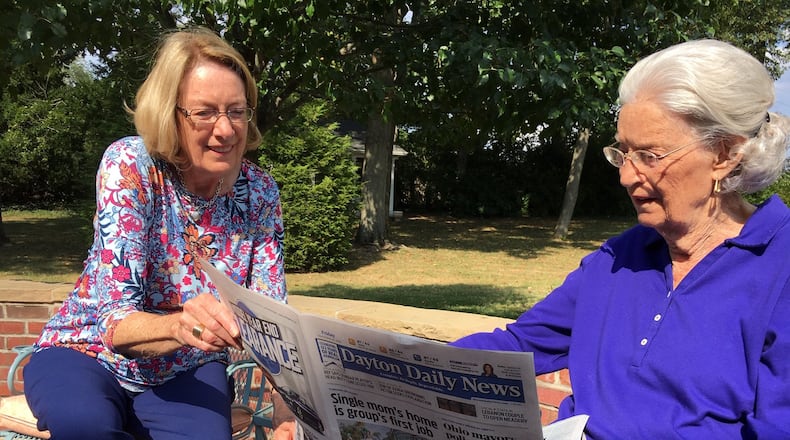 Dayton Daily News Lifelong Subscribers Kathy Kavanaugh, 71, and Ginny Whalen, 95, on the back patio of Whalen’s Kettering home