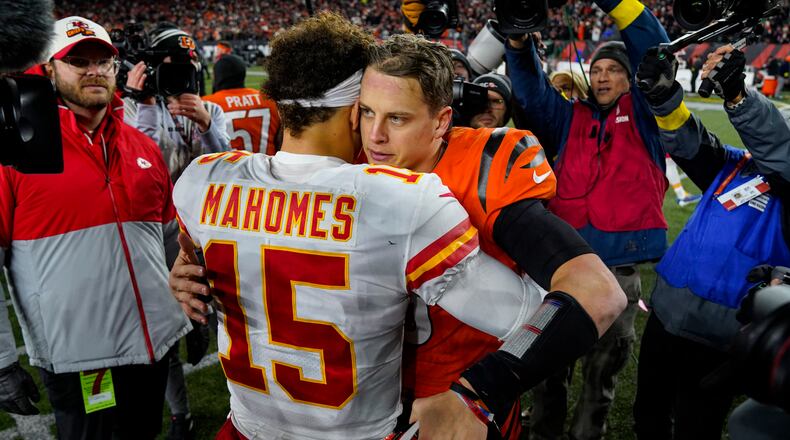 Cincinnati Bengals quarterback Joe Burrow (9) meets with Kansas City Chiefs quarterback Patrick Mahomes (15) following an NFL football game in Cincinnati, Fla., Sunday, Dec. 4, 2022. The Bengals defeated the Chief 27-24. (AP Photo/Jeff Dean)