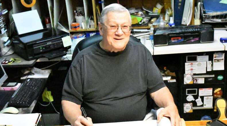 Dave Cook works in his home office in Tipp City. CONTRIBUTED PHOTO