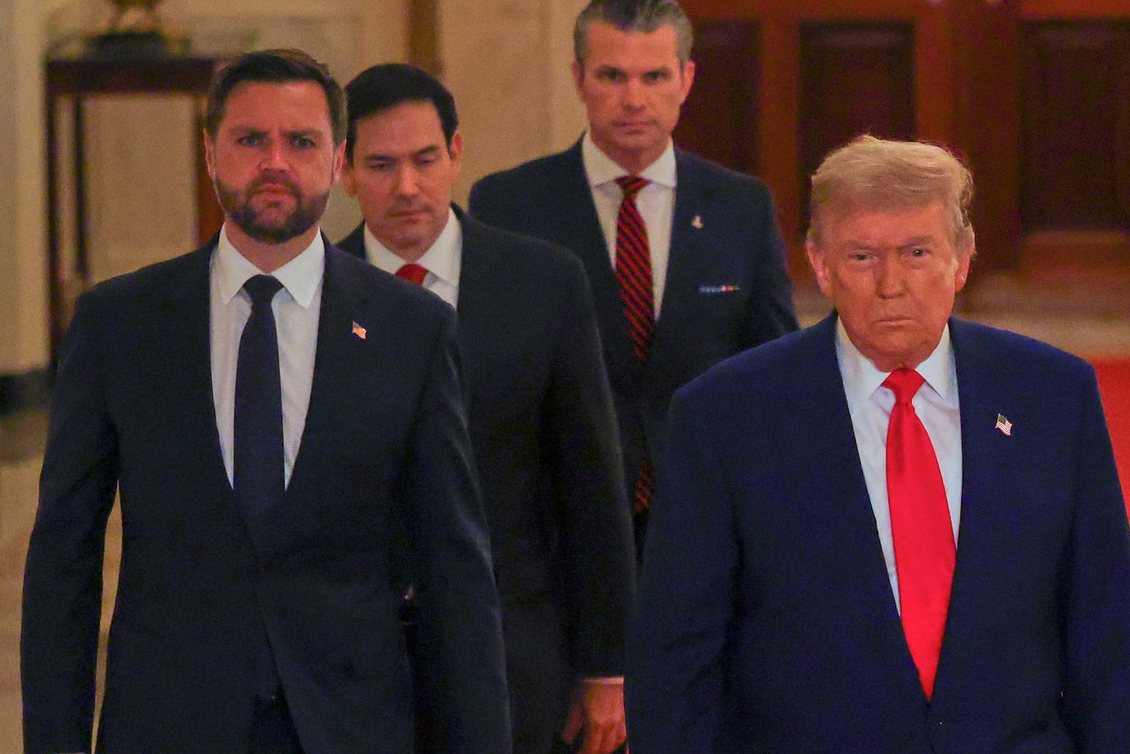 President Donald Trump arrives with Vice President JD Vance, Secretary of State Marco Rubio and Defense Secretary Pete Hegseth to speak from the East Room of the White House in Washington, Saturday, June 21, 2025, after the U.S. military struck three Iranian nuclear and military sites, directly joining Israel's effort to decapitate the country's nuclear program. (Carlos Barria/Pool via AP)