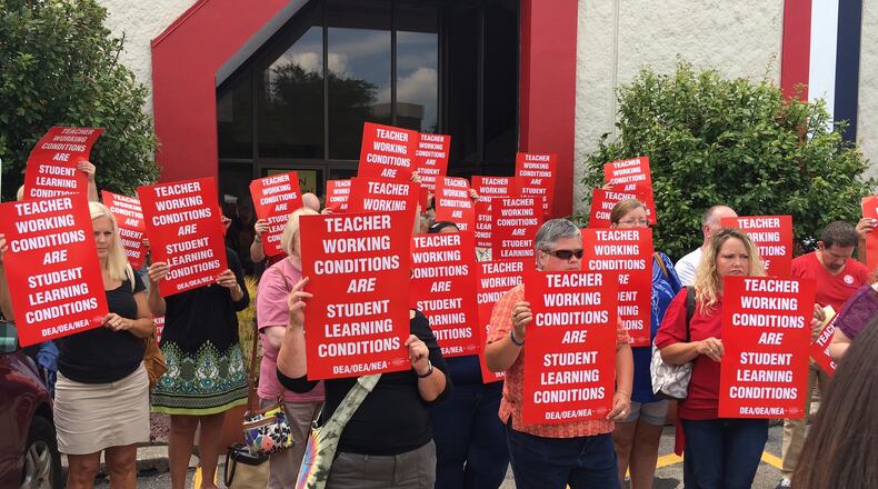 Dayton Education Association members last week protested the lack of a new contract with Dayton Public Schools. Teachers have authorized a strike if a deal is not reached by Aug. 11. STAFF