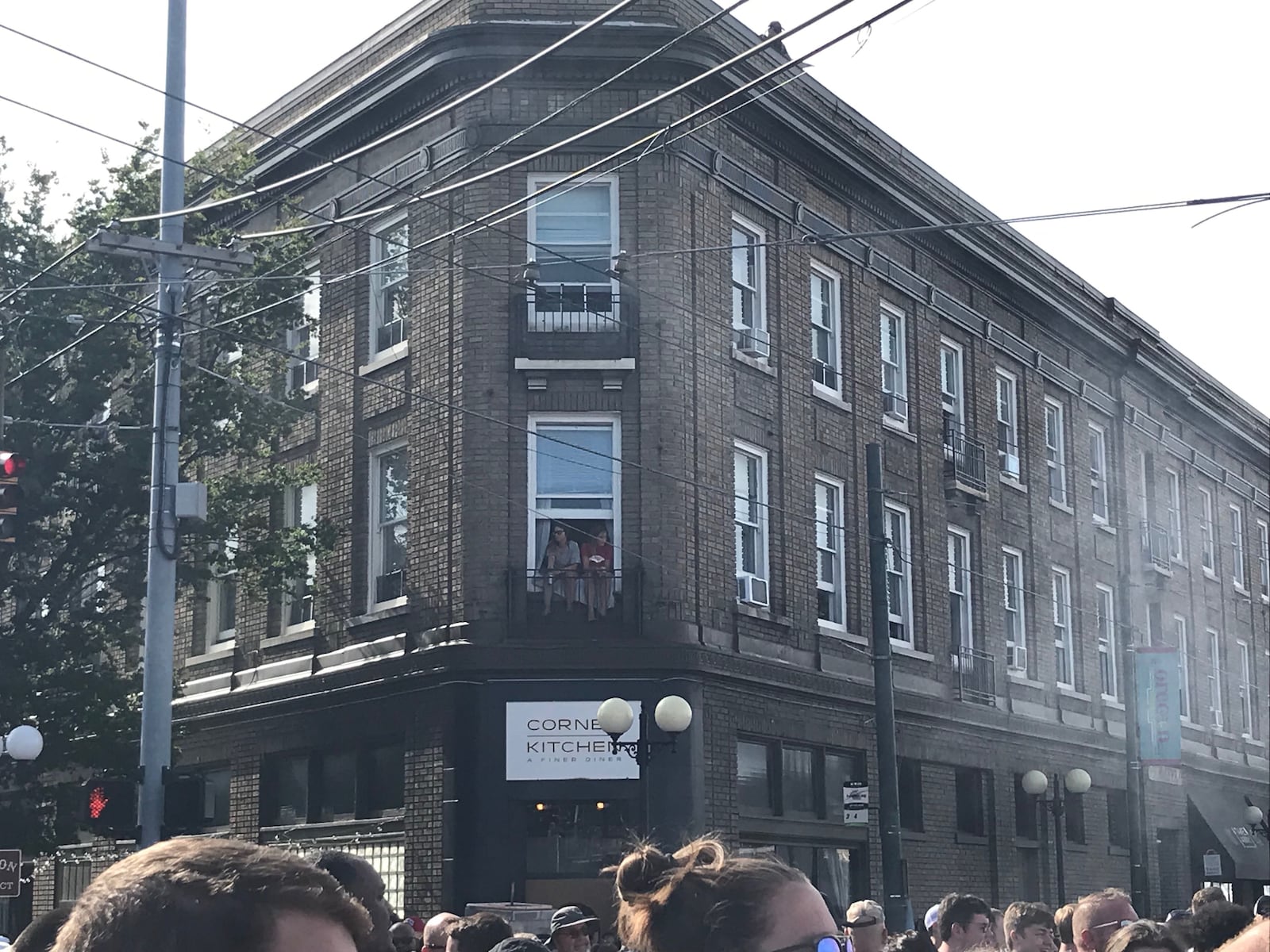 People watch the Gem City Shine block party from their apartment windows. John Stewart said it was the best seat in the house.