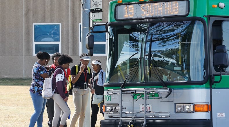 Ponitz Career Technology Center students board a Greater Dayton Regional Transit Authority bus after dismissal Tuesday. Since Aug. 12, high school students have been able to use Dayton Public Schools-paid RTA passes to ride existing routes to and from school. Starting Monday, RTA will run “limited service” routes specifically designed to serve the high schools. CHRIS STEWART / STAFF