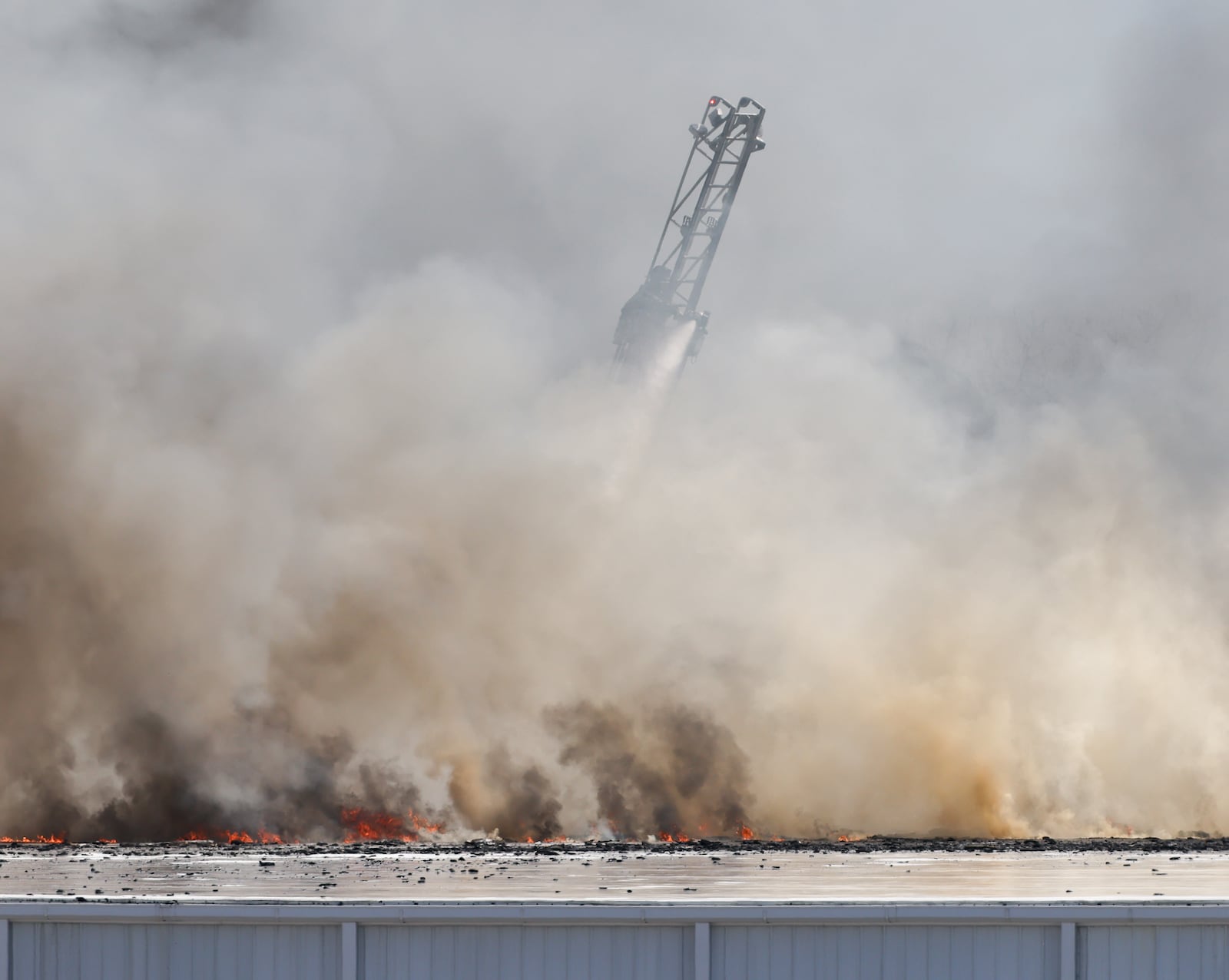 The fire at Fuyao Glass America rekindled shortly before noon on Tuesday, March 24. While firefighters have been working at the site since it first caught fire Sunday night, they had been focusing on hotspots before a large rekindling caused black smoke to rise that was visible for miles. The building that caught fire was Fuyao's coating facility, which was still in the finishing stages of construction. BRYANT BILLING / STAFF