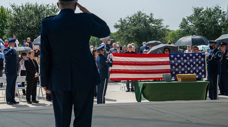 Air Force Honor Guard members fold the U.S. flag during the interment of retired Col. Richard E. Cole Sept. 7 at the Fort Sam Houston National Cemetery. Cole’s decorations include the Distinguished Flying Cross with two oak leaf clusters, Air Medal with one oak leaf cluster, Bronze Star Medal, Air Force Commendation Medal, and Chinese Army, Navy Air Corps Medal, Class A, First Grade. All Doolittle Raiders were awarded the Congressional Gold Medal in May 2014. U.S. AIR FORCE PHOTO
