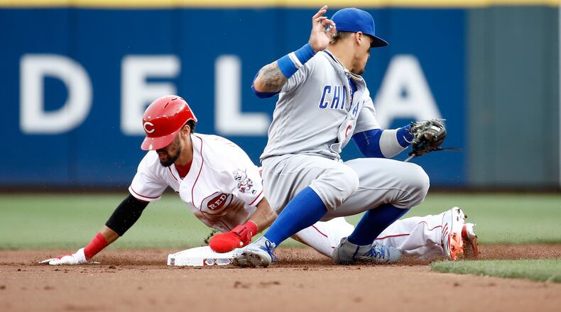 CINCINNATI, OH - AUGUST 22: Billy Hamilton #6 of the Cincinnati Reds slides safely into second base for a stolen base ahead of the tag by Javier Baez #9 the Chicago Cubs at Great American Ball Park on August 22, 2017 in Cincinnati, Ohio. (Photo by Andy Lyons/Getty Images)