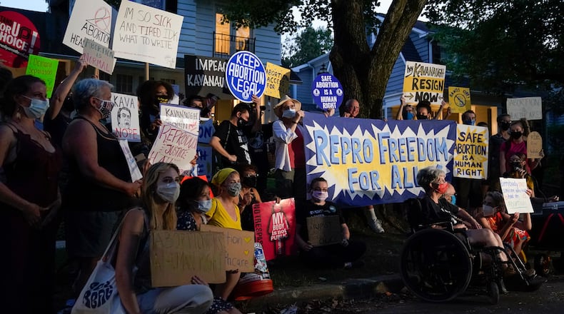 Protesters gather outside the home of Supreme Court Justice Brett Kavanaugh, Monday, Sept. 13, 2021, in Chevy Chase, Md., after a high-profile decision earlier this month in which the court by 5-4 vote declined to step in to stop a Texas law banning most abortions from going into effect, prompting outrage from abortion rights groups and President Joe Biden. (AP Photo/Patrick Semansky)