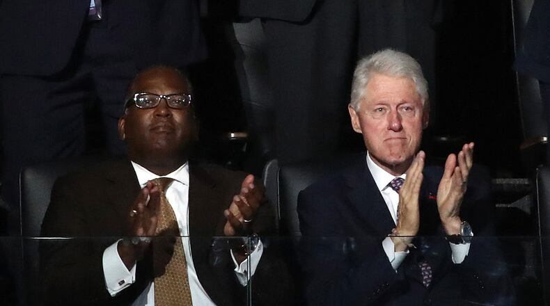 PHILADELPHIA, PA - JULY 25: Former U.S. President Bill Clinton (R) claps during first lady Michelle Obama's speech on the first day of the Democratic National Convention at the Wells Fargo Center, July 25, 2016 in Philadelphia, Pennsylvania. An estimated 50,000 people are expected in Philadelphia, including hundreds of protesters and members of the media. The four-day Democratic National Convention kicked off July 25. (Photo by Win McNamee/Getty Images)