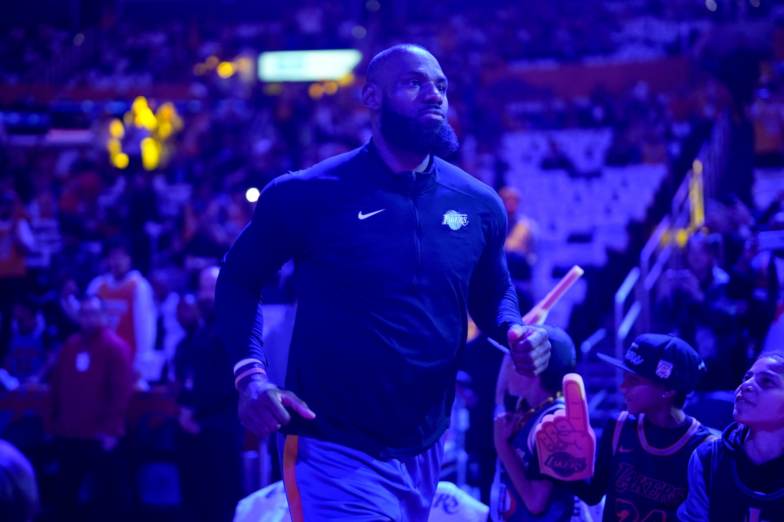 Los Angeles Lakers forward LeBron James takes the court before Game 2 of an NBA basketball first-round playoff against the Minnesota Timberwolves in Los Angeles, Tuesday, April 22, 2025. (AP Photo/Eric Thayer)