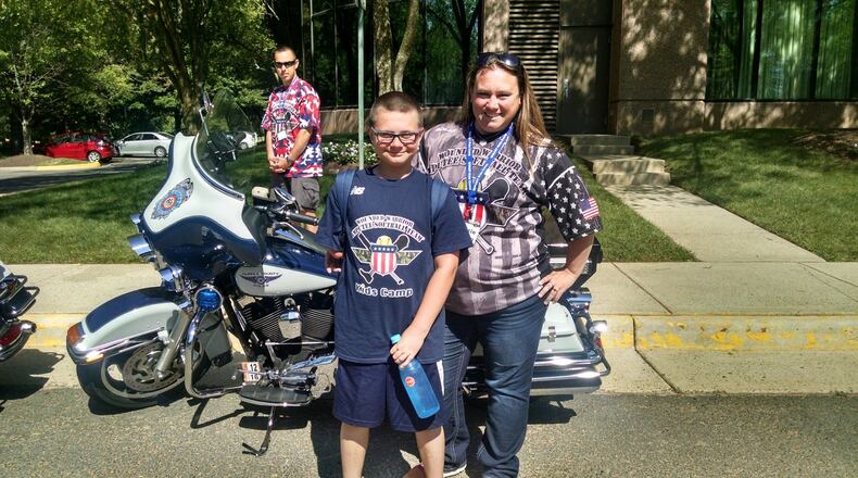 Austin Osner and his mother, Kristin McGinn, are bringing the Wounded Warrior Amputee Softball Team to Butler County in 2018. Osner was born without most of his right arm and went to a camp sponsored by the Warriors. CONTRIBUTED